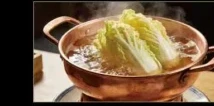 Adding vegetables to the simmering broth
